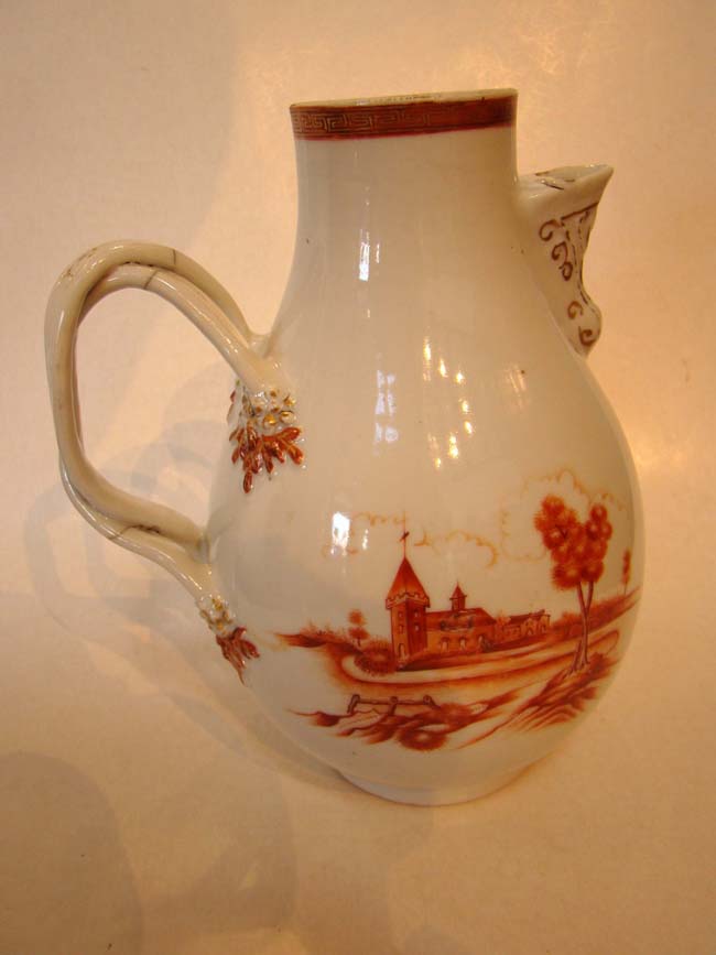 A beautiful late 18th century Chinese Export Porcelain orange decorated jug with condition issues